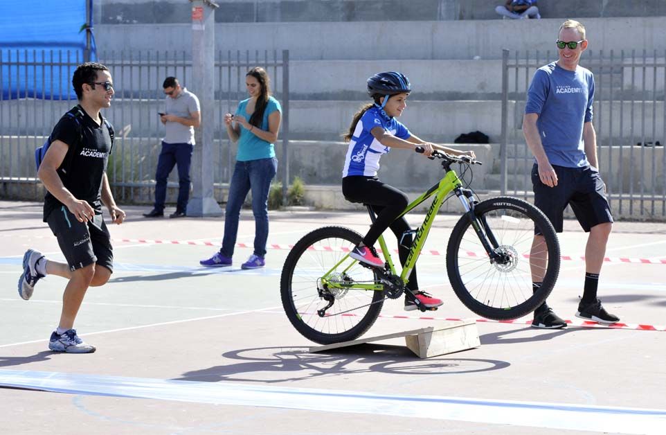 The children got to test out their new bicycles with some assistance from the riders