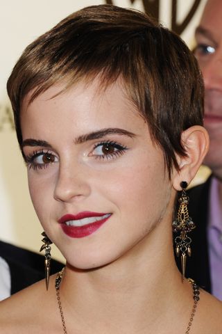 Emma Watson has a short pixie cut as she attends the reception to celebrate the new Warner Brothers Leavesden Studios at Claridge's on November 10, 2010 in London, England.