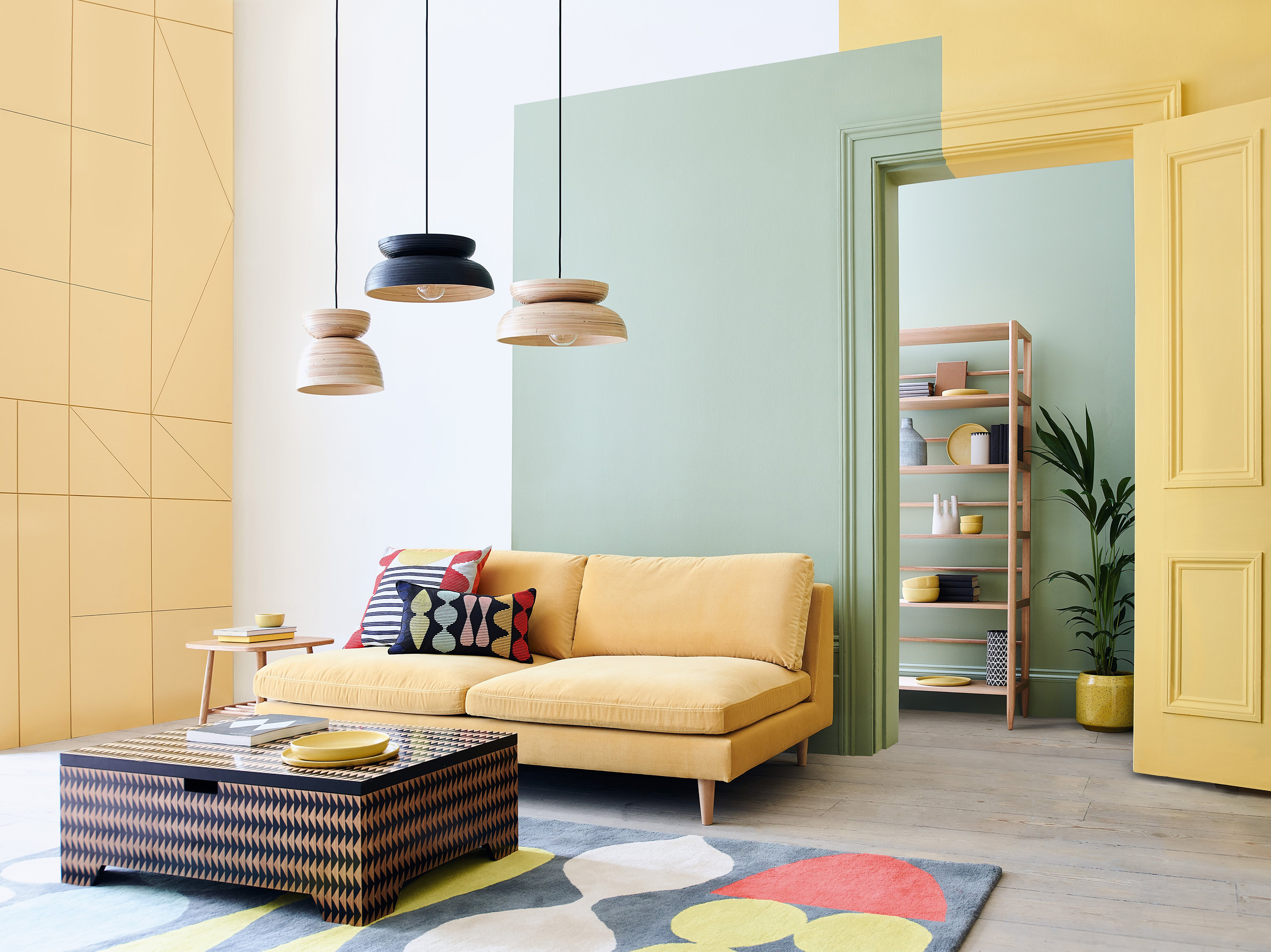 Colourful living room with colour blocking trend in yellow and green