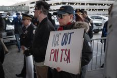 CHICAGO, ILLINOIS - MARCH 27: Demonstrators protest Department of Homeland Security assigning ICE agents to work alongside TSA agents at O'Hare International Airport on March 27, 2026 in Chicago, Illinois. The travel disruptions continue as hundreds of TSA agents quit or work without pay during a partial government shutdown. U.S. President Donald Trump said ICE agents will be deployed to U.S. airports on Monday, with border czar Tom Homan in charge of the effort. (Photo by Scott Olson/Getty Images)