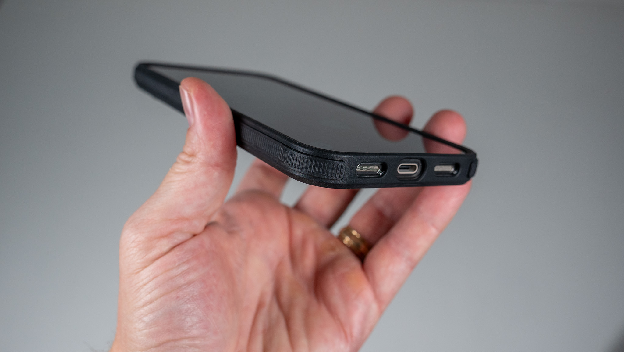 A Dbrand Ghost 2.0 case on a white Google Pixel 10 Pro XL