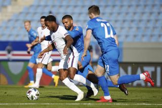 Raheem Sterling, left, is challenged by Iceland's Victor Palsson and Jon Dadi Bodvarsson