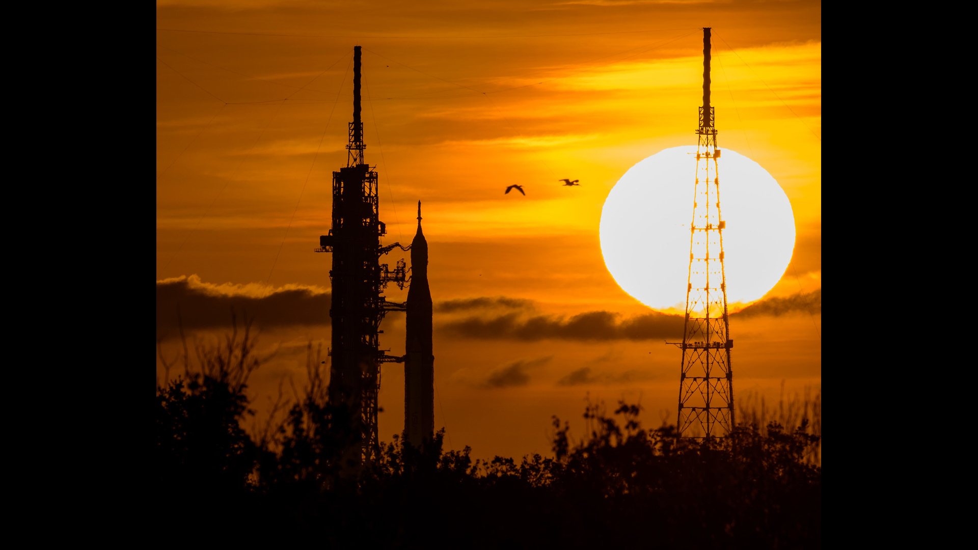 A stunning sunrise image of NASA's Space Launch System moon rocket three days before its second attempt to launch for the groundbreaking Artemis 1 mission.