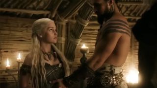 Jason Momoa touches Emilia Clarke's belly in Game of Thrones Season 1.