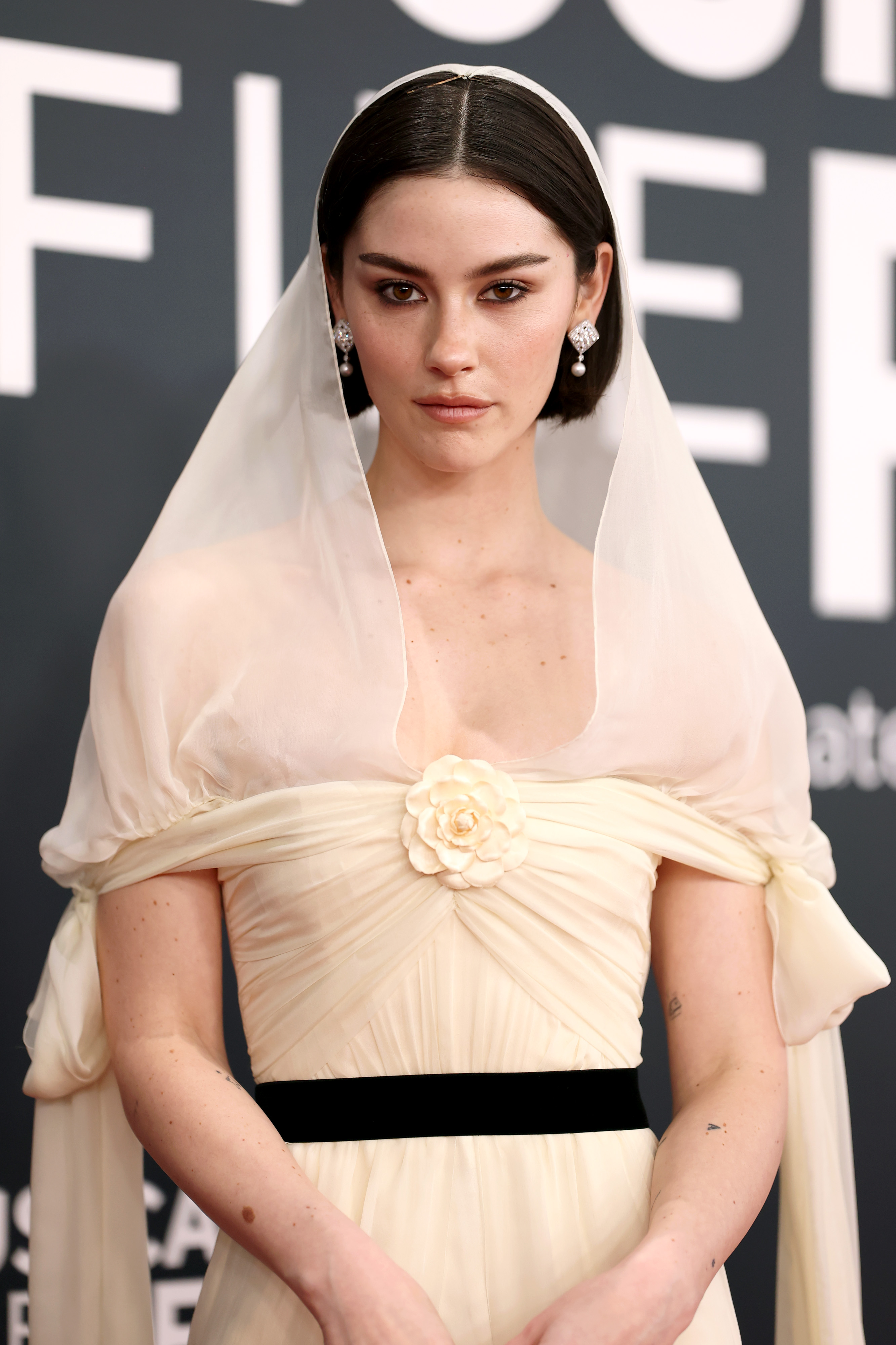 Gracie Abrams wearing Chanel gown and Chanel jewels on 2025 Grammys Red Carpet