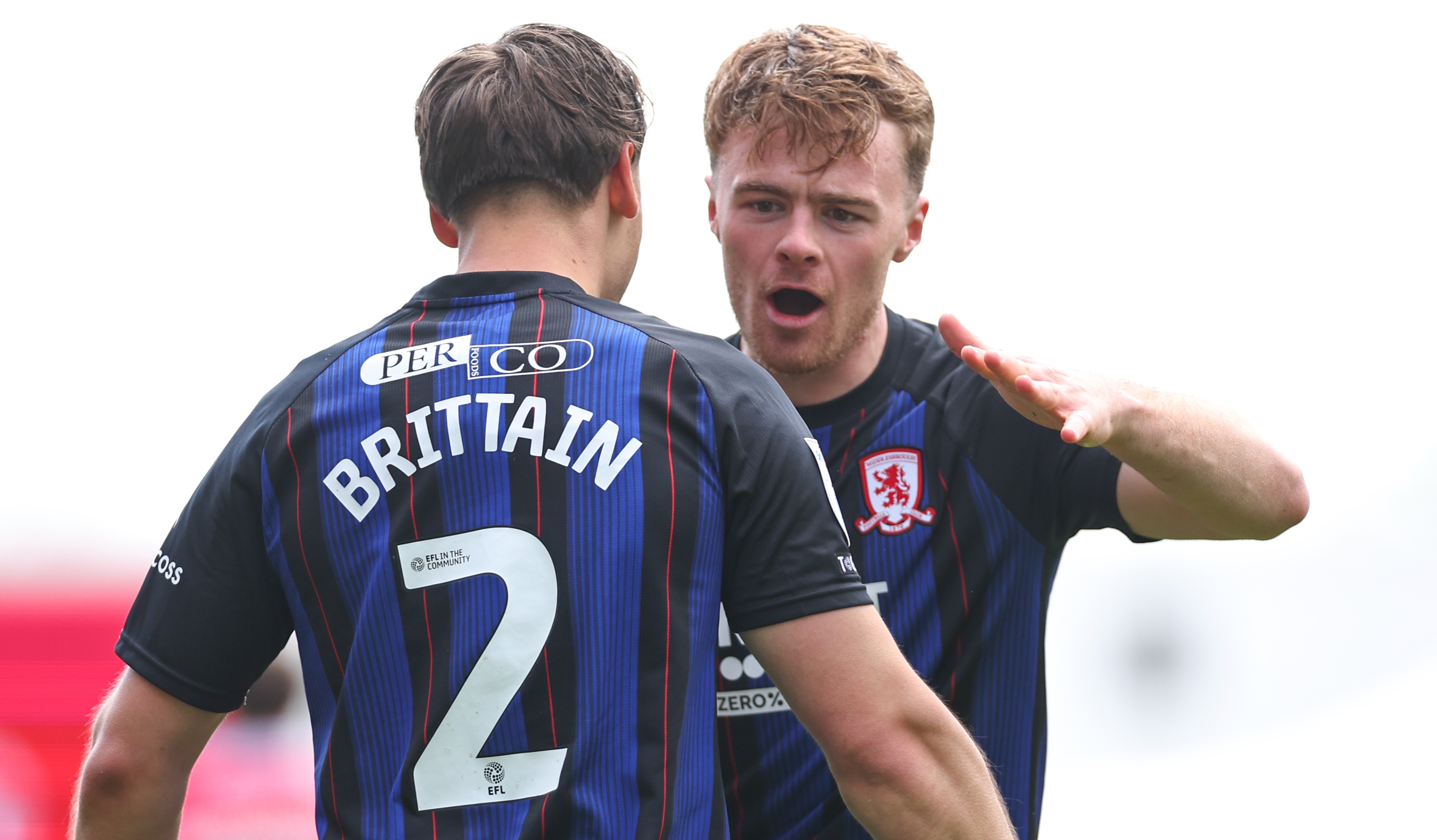Middlesbrough striker Tommy Conway with Callum Brittain after scoring against Wrexham in the Championship