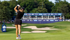 A golfer hits a shot from the fairway at Aramco Team Series Shenzhen