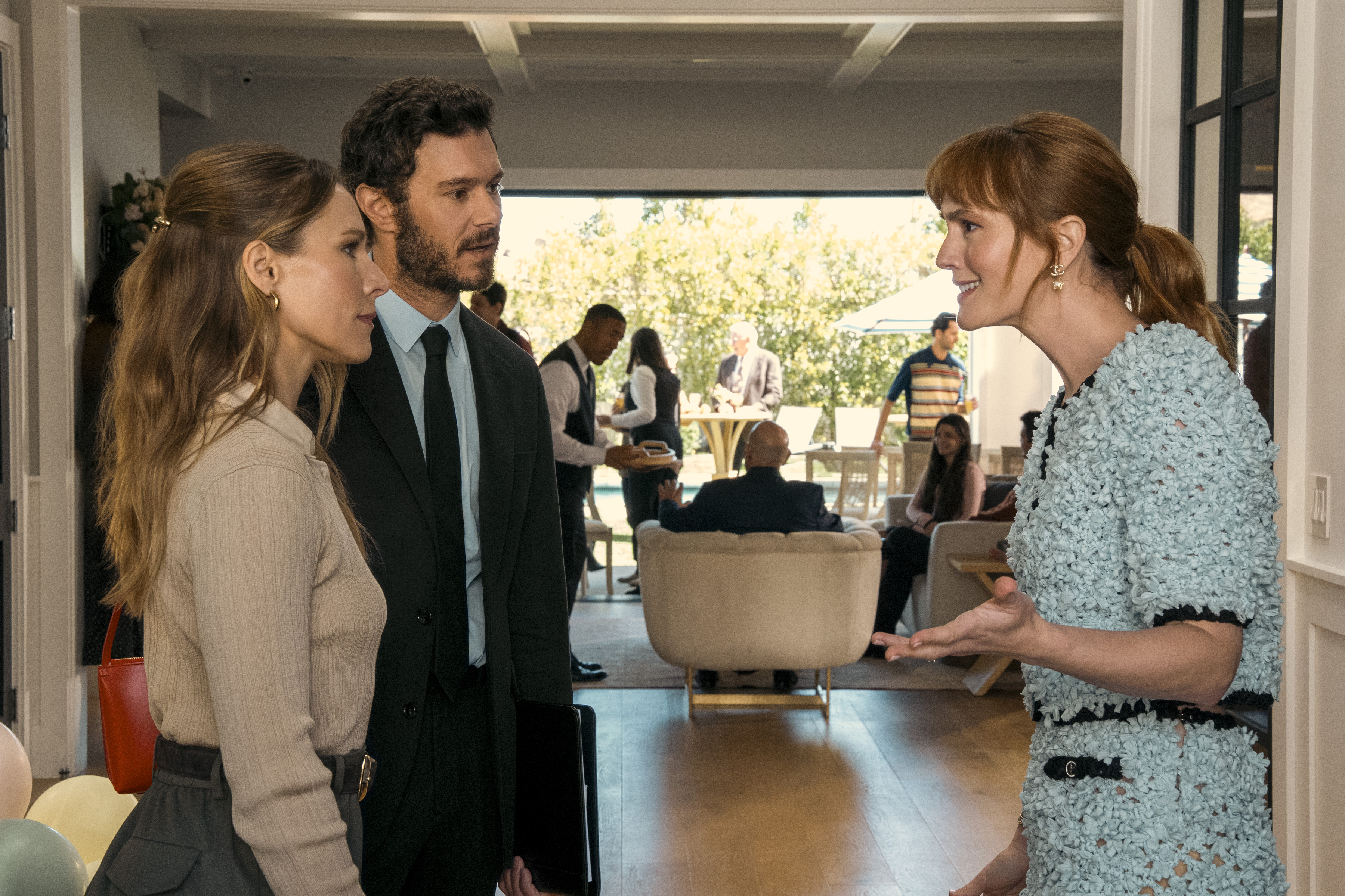 adam brody and kristen bell speak with leighton meester at a party in a still from nobody wants this season 2
