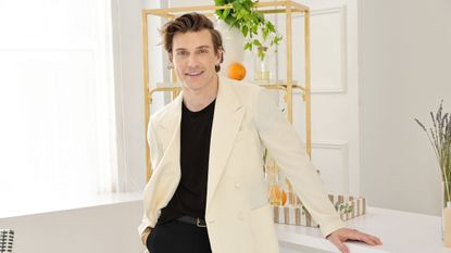 Jeremiah Brent in white jacket at event