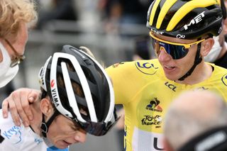 Team UAE Emirates Tadej Pogacar of Slovenia wearing the overall leaders yellow jersey R talks to Team Jumbo Vismas Jonas Vingegaard of Denmark wearing the best youngs white jersey after the 18th stage of the 108th edition of the Tour de France cycling race 129 km between Pau and Luz Ardiden on July 15 2021 Photo by Philippe LOPEZ AFP Photo by PHILIPPE LOPEZAFP via Getty Images