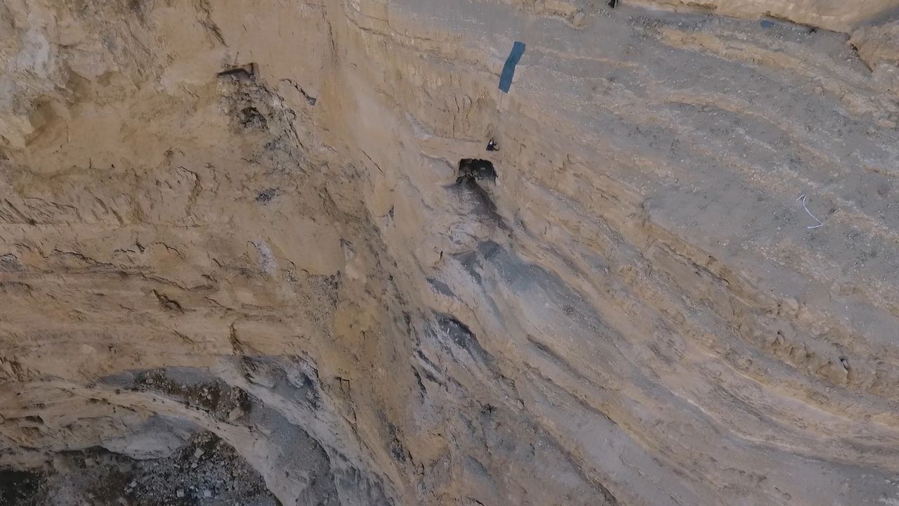 Scientists rappel to the Cave of Horror.