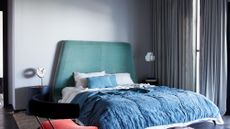 A bedroom with grey walls