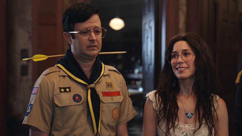 Richie Moriarty as Pete and Sheila Carrasco as Flower in a scene from "Ghosts US" season 5.