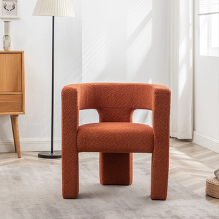 Rust boucle accent chair.