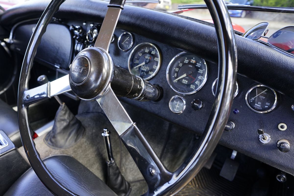 The steering wheel and dashboard of a classic car