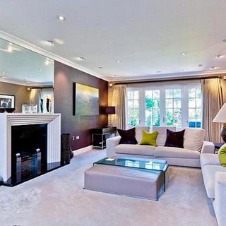 living room with fire place and carpet flooring with white ceiling