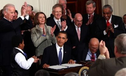 President Obama signs the Affordable Health Care for America Act into law on March 23, 2010: Now, the Supreme Court will decide whether "ObamaCare" is even constitutional.