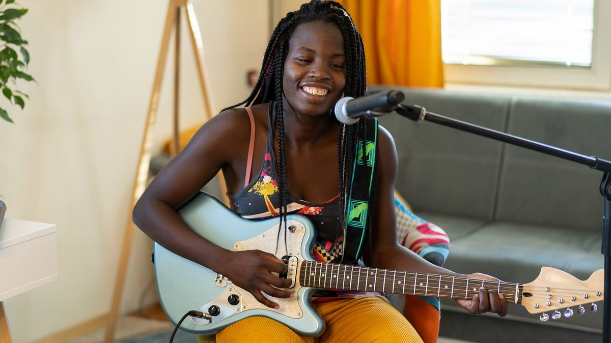 Woman playing guitar