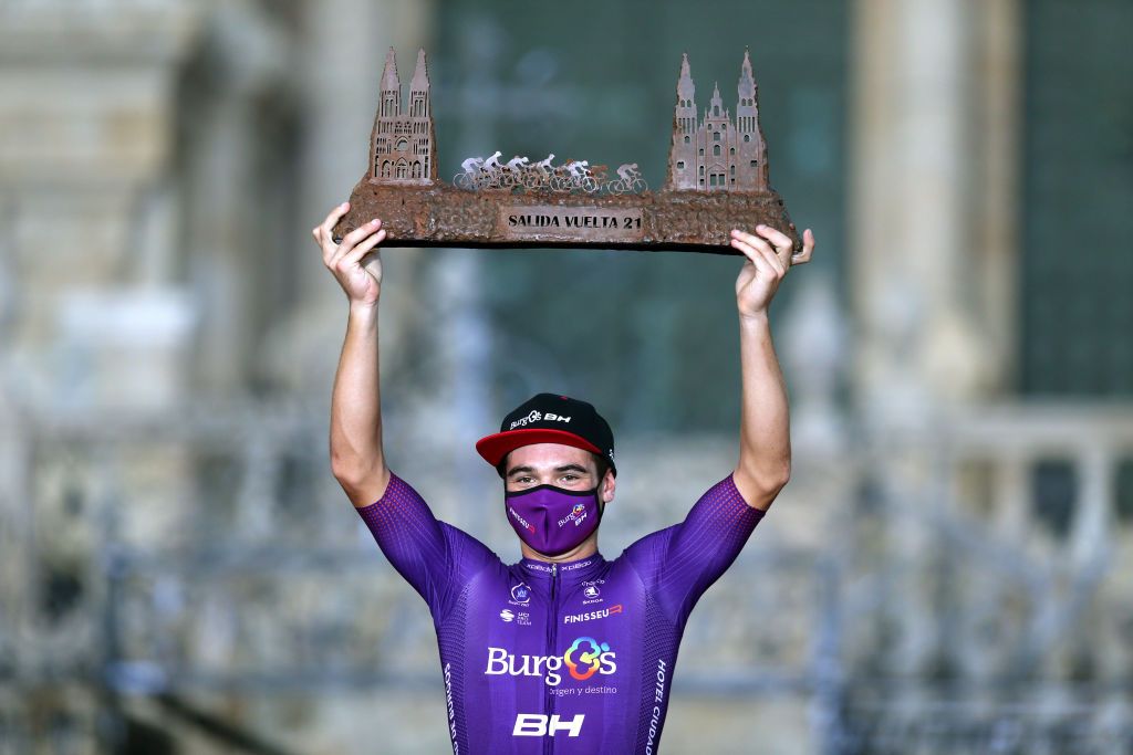 SANTIAGO DE COMPOSTELA SPAIN SEPTEMBER 05 Carlos Canal Blanco of Spain and Team Burgos BH celebrates winning the Cathedrals trophy on the podium ceremony after the 76th Tour of Spain 2021 Stage 21 a 338 km Individual Time Trial stage from Padrn to Santiago de Compostela lavuelta LaVuelta21 ITT on September 05 2021 in Santiago de Compostela Spain Photo by Gonzalo Arroyo MorenoGetty Images