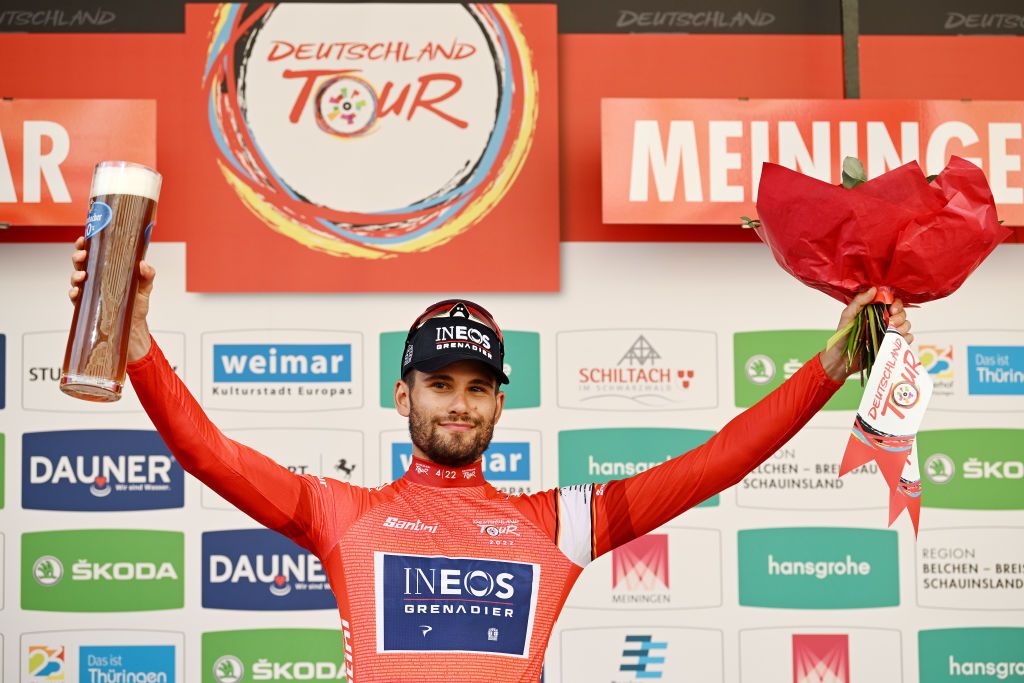 MEININGEN GERMANY AUGUST 25 Filippo Ganna of Italy and Team INEOS Grenadiers celebrates winning the Red Leader Jersey on the podium ceremony after the 37th Deutschland Tour 2022 Stage 1 a 1717km stage from Weimar to Meiningen DeineTour on August 25 2022 in Meiningen Germany Photo by Stuart FranklinGetty Images