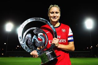 Arsenal Women Captain Steph Houghton poses with the trophy after winning the FA WSL Continental Cup Final between Arsenal Women and Lincoln Women at The Hive on October 4, 2013 in Barnet, England.