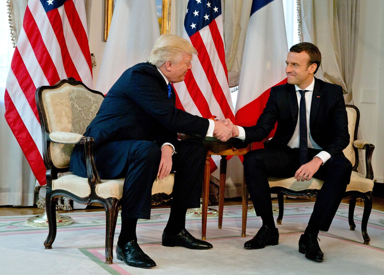 President Trump shakes hands with Emmanuel Macron in Brussels