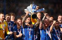 Portsmouth City players celebrate winning the Sky Bet League One competition during a cup presentation following the Sky Bet League One match between Portsmouth and Wigan Athletic at Fratton Park on April 20, 2024 in Portsmouth, England. (Photo by Peter Nicholls/Getty Images)