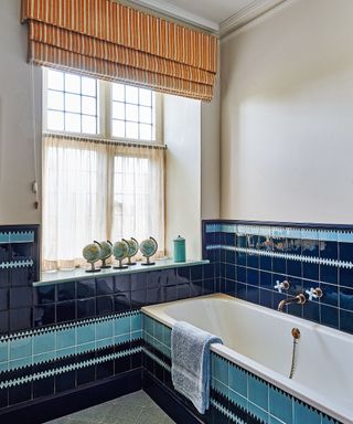 Built-in bathtub with blue tiles