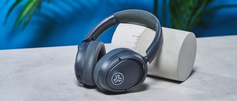 a pair of graphite gray headphones by JLab with 3 buttons