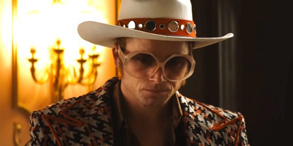 Rocketman Taron Egerton looking upset in full Elton John regalia