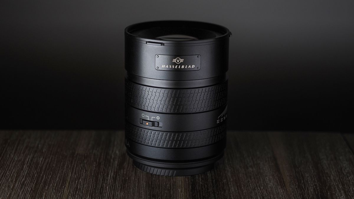 Hasselblad XCD 90V on a wooden surface against a dark background