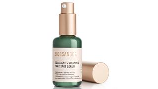 Biossance Squalane and Vitamin C Dark Spot Serum in a green bottle with rose gold lid, picked as one of the best vitamin c serum options for dry skin