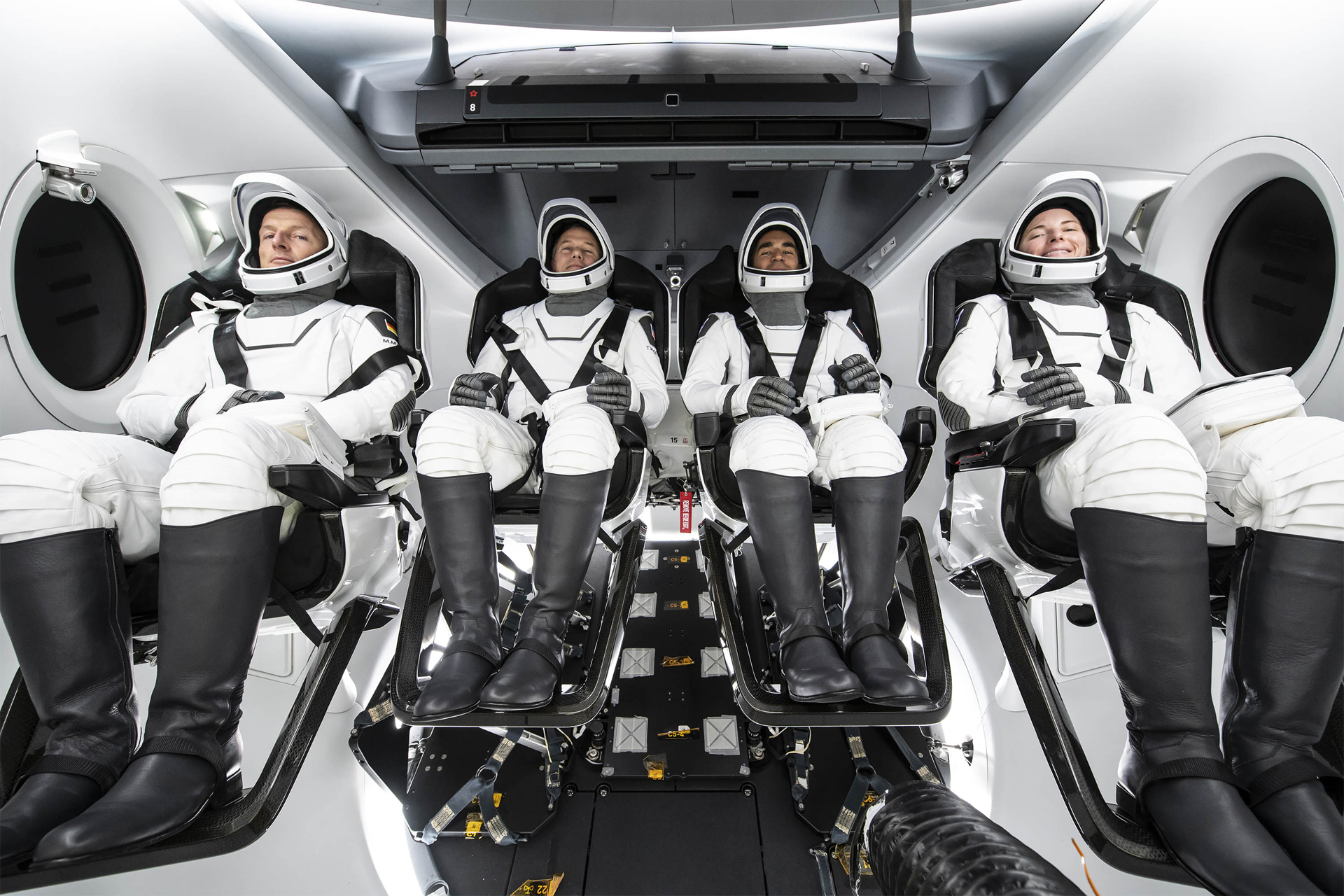 The Crew-3 astronauts pose for a group photo inside SpaceX's Crew Dragon spacecraft. They are: (from left) ESA astronaut Matthias Maurer, mission specialist; NASA astronauts Tom Marshburn, pilot; Raja Chari, commander; and Kayla Barron, mission specialist.