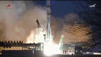 rocket launching into the early evening sky