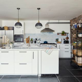 kitchen room with marble worktop and white cabinets with chimney