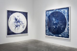 The image on the right is a cyanotype of the painting on the left. Cyanotyping creates a negative image of the original, similar to how photographs are made from film.