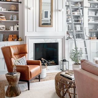 white living room with brown leather chair