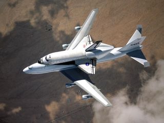 NASA space shuttle Columbia hitched a ride on a special 747 carrier aircraft for the flight from Palmdale, California, to Kennedy Space Center, Florida, on March 1, 2001.