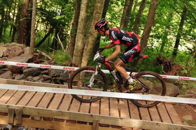 Stephen Ettinger (BMC) crossing a bridge in 4th place