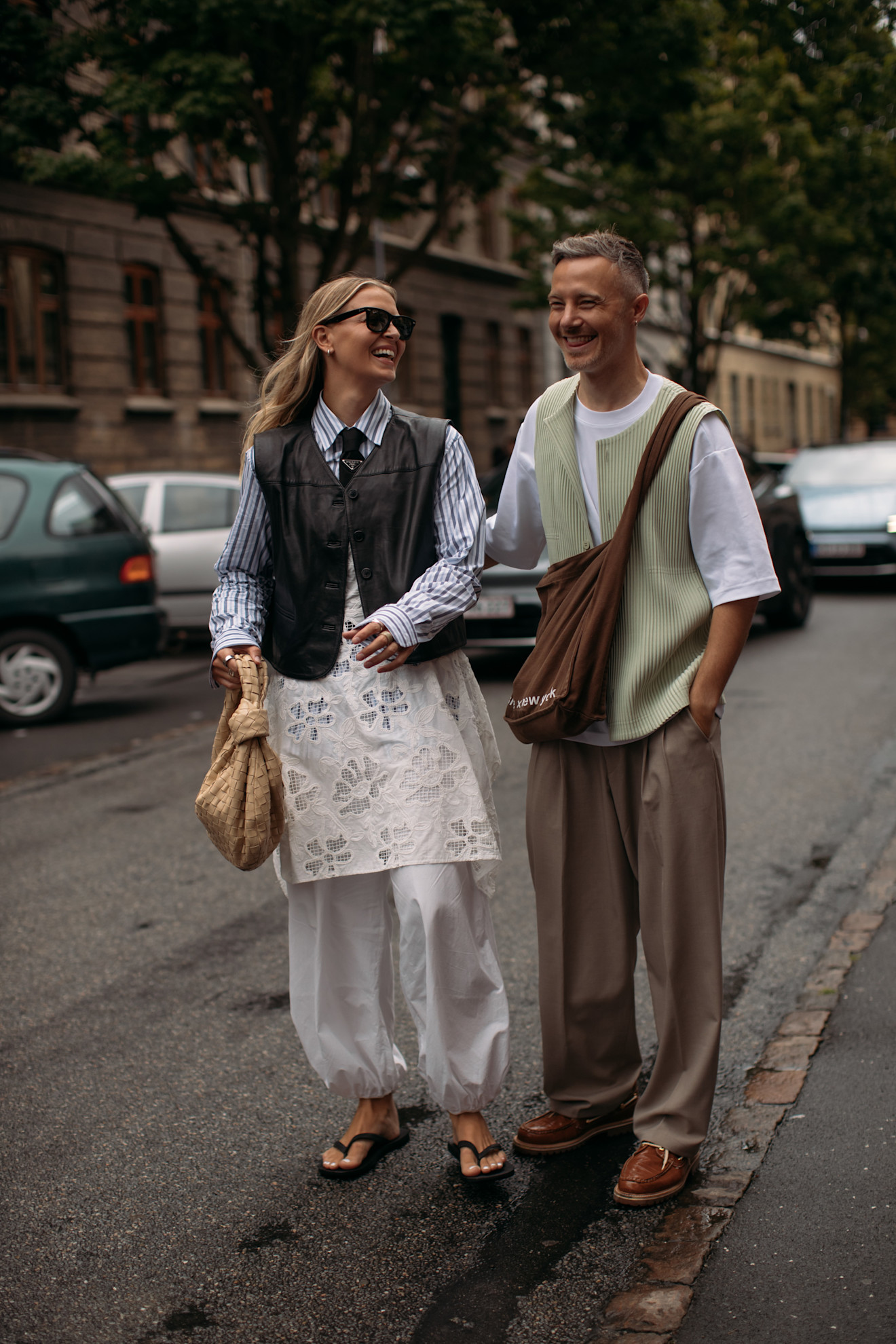 guests at Copenhagen Fashion Week style flip flops with pants, suits, and barn jackets
