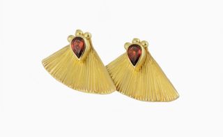Gold fan earrings with a red garnet stud