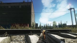 Escape from Tarkov holding a gun outside