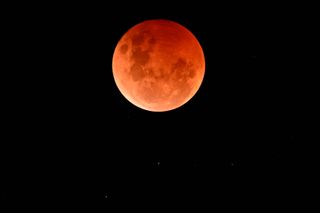 The blood moon rises red and ghostly on Nov. 8, 2022