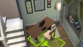 The Sims 4 - a desk being selected and rotated in build mode.