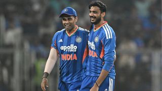 India's Axar Patel (R) celebrates with captain Suryakumar Yadav after taking the wicket of New Zealand's Glenn Phillips during the fifth and final Twenty20 international cricket match between India and New Zealand at the Greenfield International Stadium in Thiruvananthapuram on January 31, 2026. (Photo by R. Satish BABU / AFP via Getty Images) / -- IMAGE RESTRICTED TO EDITORIAL USE - STRICTLY NO COMMERCIAL USE --