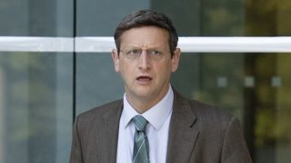 Ron standing outside confused in The Chair Company Episode 2