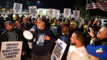 Harold Daggett, president of the International Longshoremen&#039;s Association, rallies union members as they begin strike