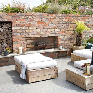 outdoor fireplace with brick walls