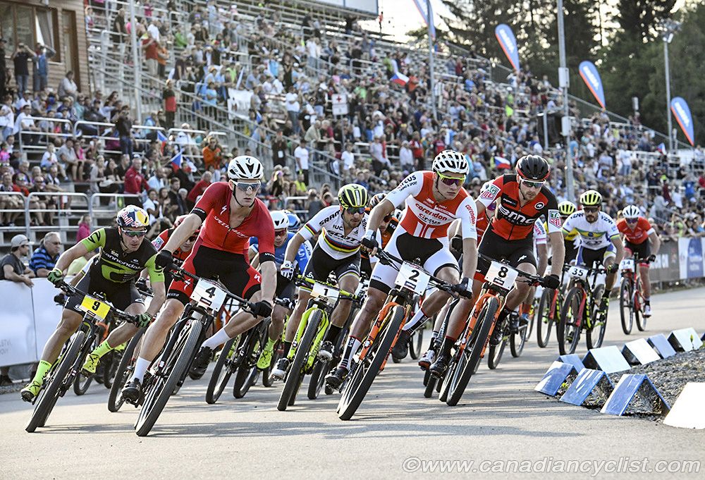 Start of men's race, first corner