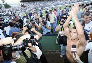 Carlos Tevez celebrates with the fans after Corinthians' Brazilian championship title win in December 2005.